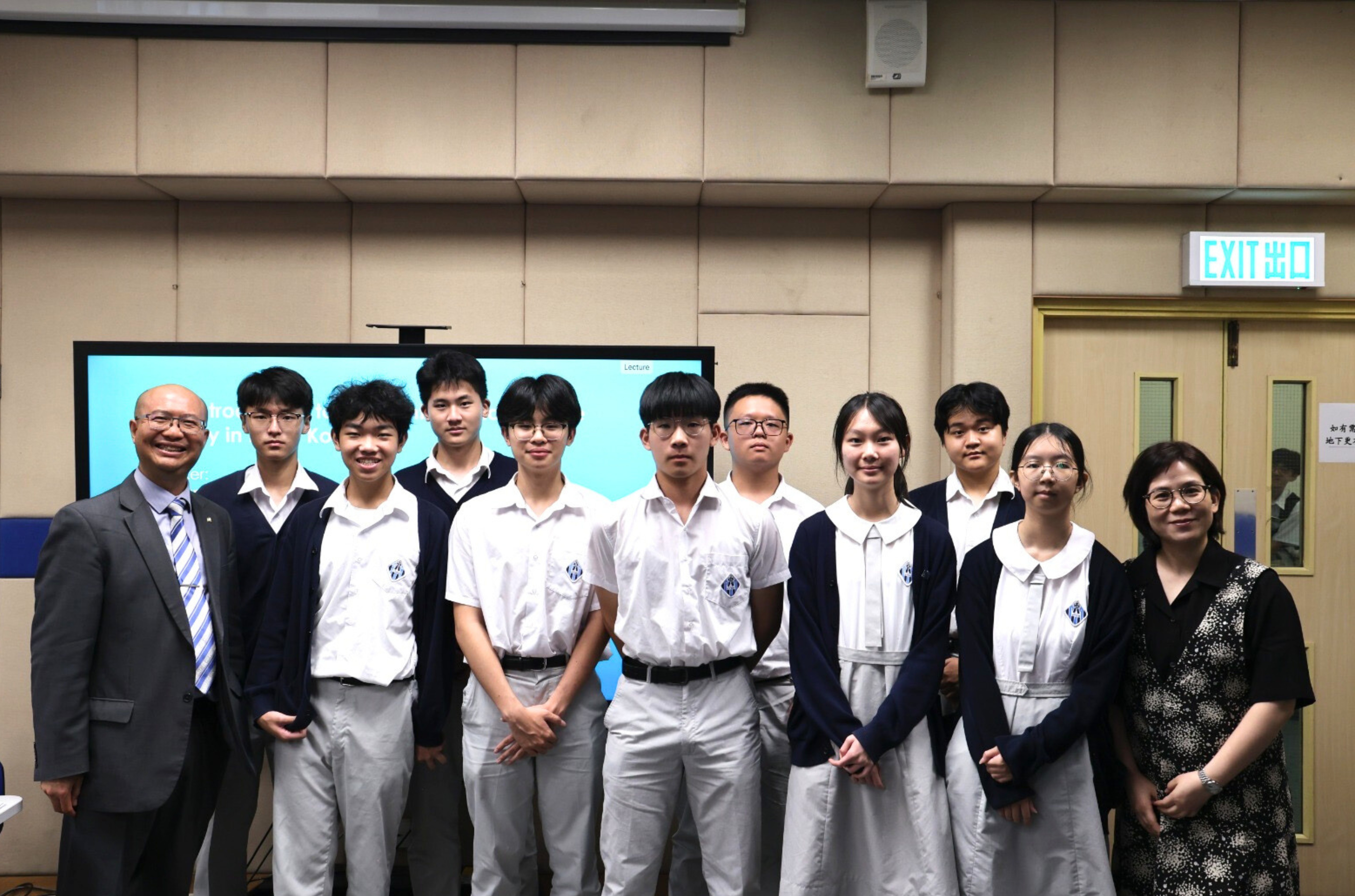 Dr. Man KO, Senior Lecturer and Associate Head (Teaching), the Department of Accountancy, Economics and Finance (far left), and Ms. Macy WONG, Panel Head of BAFS and Careers Mistress, SKH Chan Young Secondary School (far right), pictured with participating secondary school students.
