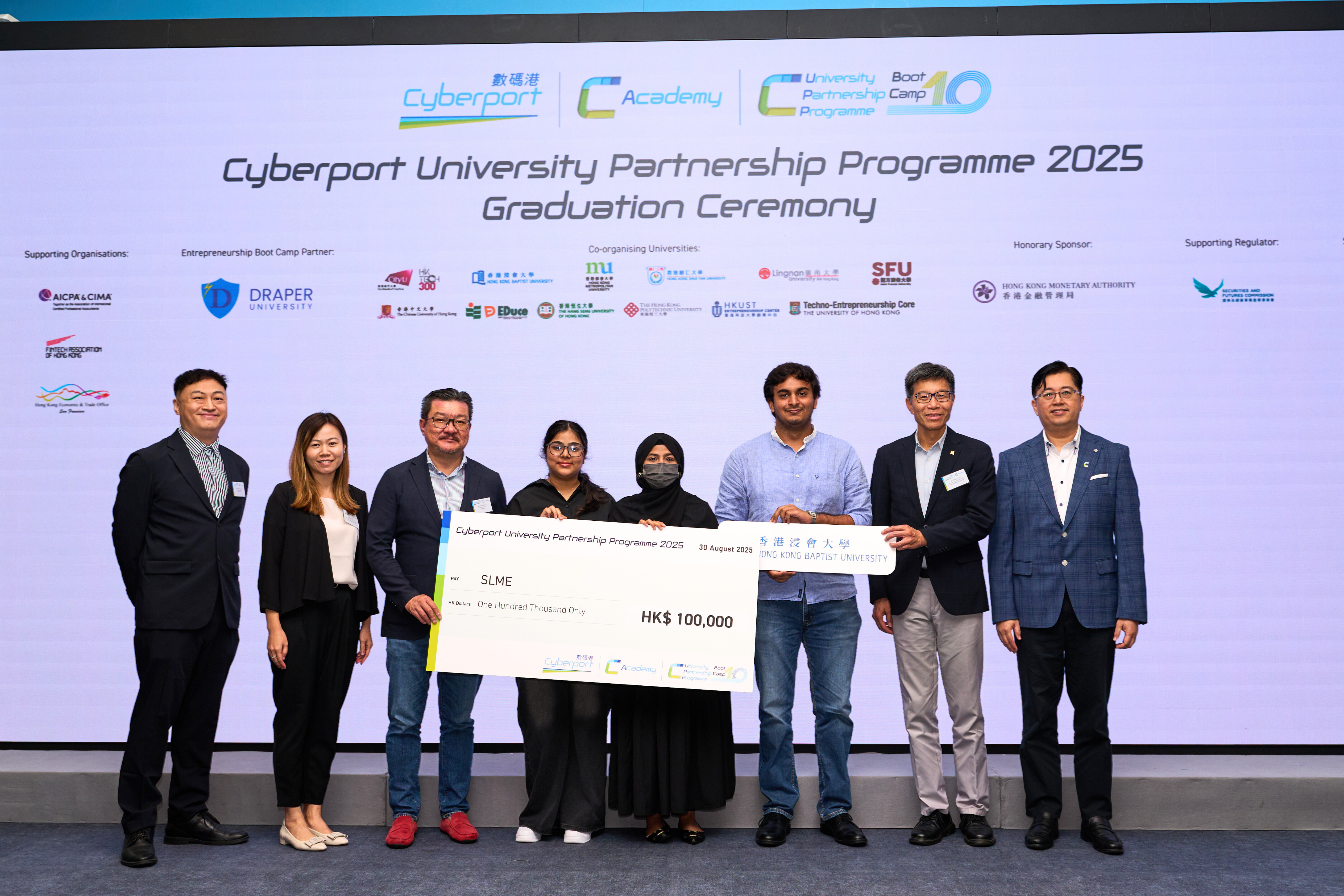 Mr. Kartikay DHAR (3rd from the right) and his team receive a HK$100,000 seed fund for their AI-driven smart glasses project in promoting inclusion for the deaf community.