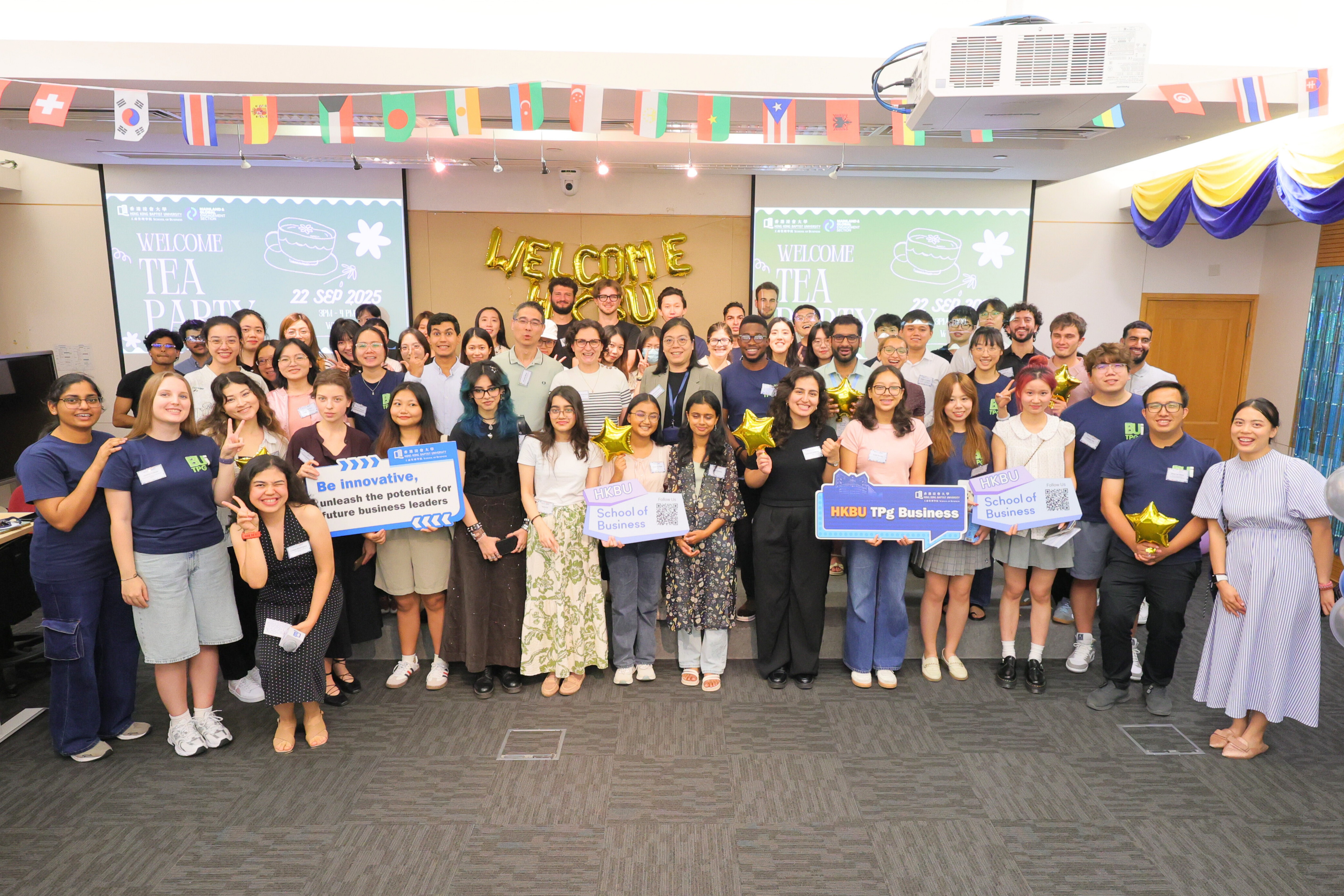 Participants gathered for a group photo at the Welcome Tea Party.