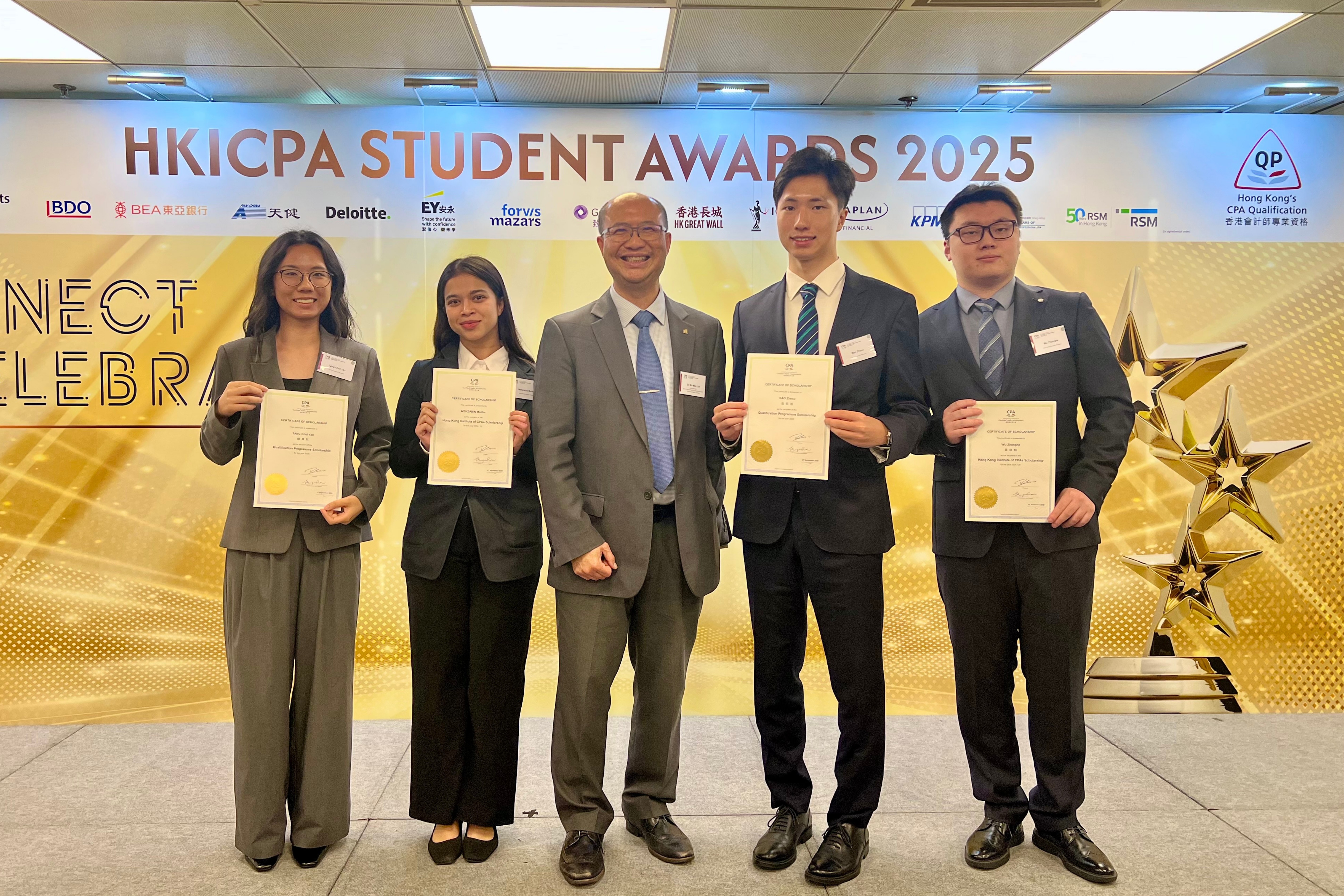 Qualification Programme Scholarship recipients: Chui Yan TANG (1st from the left) and Zhexu BAO (2nd from the right), and HKICPA Scholarship recipients: Mehzabin MALIHA (2nd from the left) and Zhenghe WU (1st from the right), pictured with Dr. Man KO (centre), Associate Head (Teaching) and Senior Lecturer, Department of Accountancy, Economics and Finance.