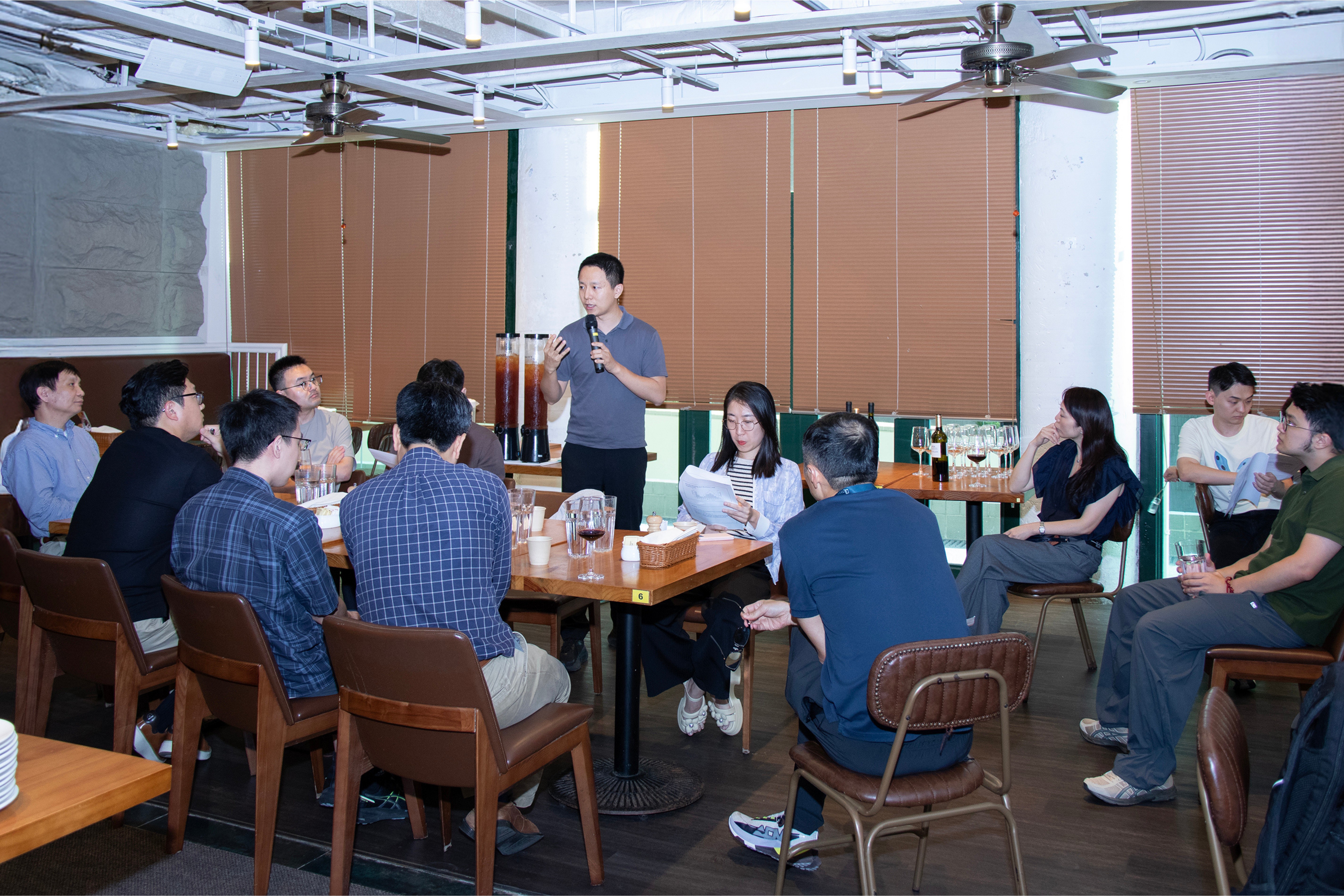 Faculty members connect at the Research Happy Hour to explore key socio-economic and technological issues.