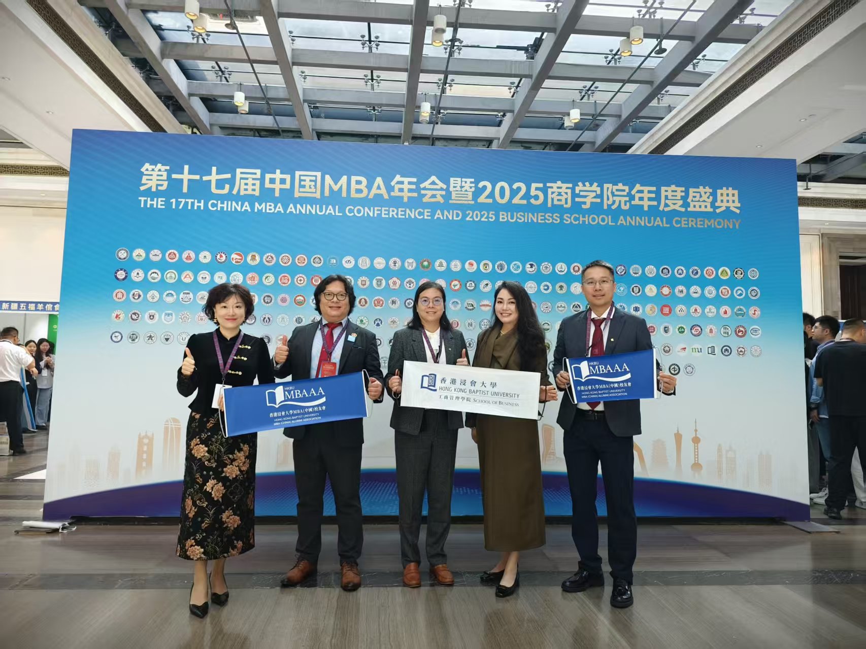 A group photo showing Professor Monique Shui-ki Wan (middle), Associate Dean (Taught Postgraduate Studies), Mr Fan Jiaqi (2nd left), Chairman of HKBU MBA (China) Alumni Association, and MBA alumni representatives (1st right, 2nd right and 1st left)