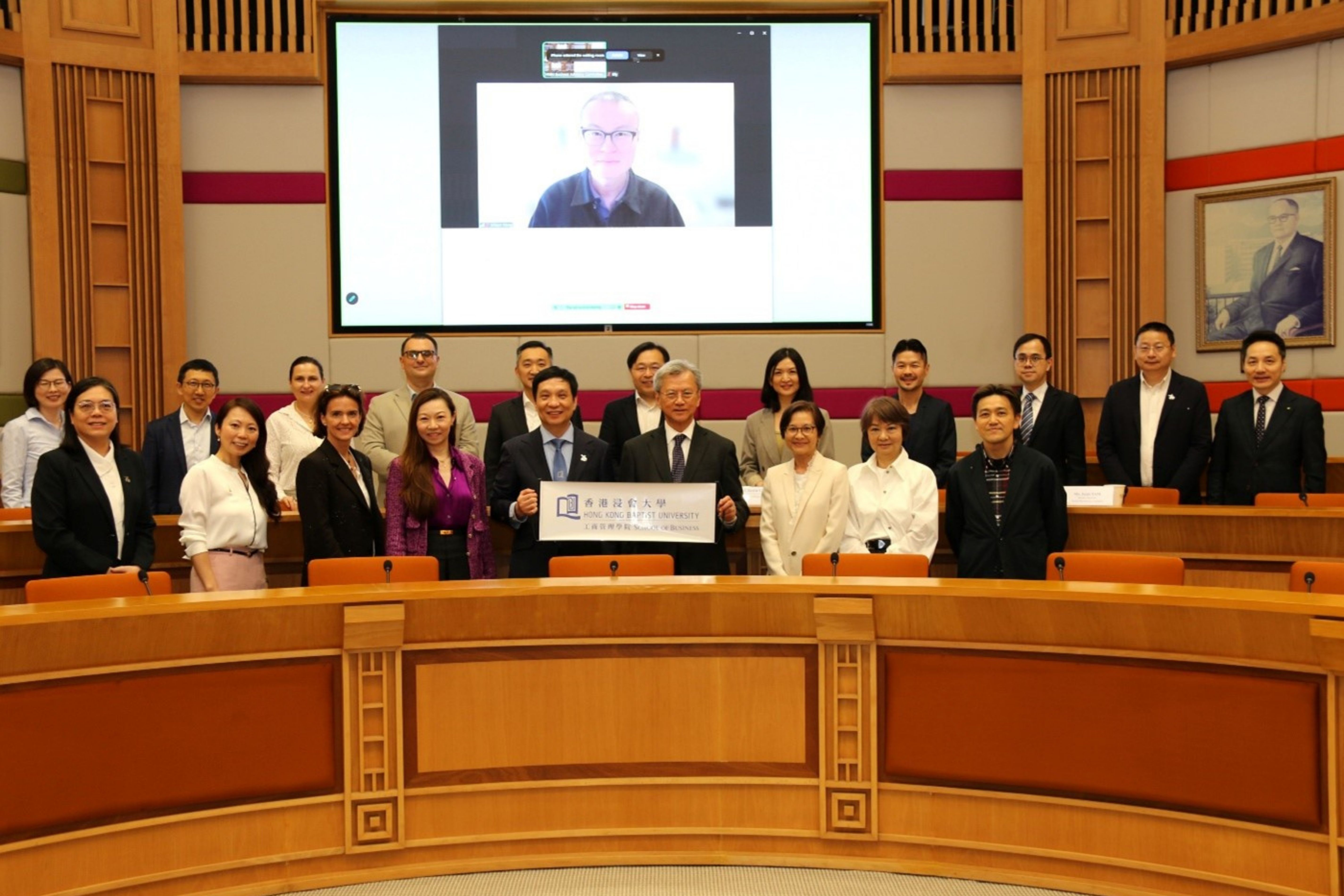 The meeting was attended by faculty members and industry leaders, including:  •	Online: Professor Wilson Wong, Adjunct Professor, HKBU School of Business •	Back row (from left): Dr Liu Jing, Assistant Dean (Outreach and Engagement), HKBU School of Business, Professor Byron Song, Head, Department of Accountancy, Economics and Finance (AEF), HKBU School of Business, Dr Marta Dowejko, Assistant Dean (Global Engagement), HKBU School of Business, Mr Jovan Trajceski, Global Analytics Partner, H&M Group, Mr Edmond Tin, Managing Director, Head of Hong Kong Coverage, HSBC, Mr Ambrose Tang, Deputy Managing Director & Chief Cyber Security and Privacy Officer (Hong Kong Rep. Office), Huawei Technologies, Ms Freda Ng, Managing Director, PARKnSHOP, Dr Gary Chan, Executive Director, Chief Financial Officer and Chief Sales Officer, Giordano International Limited, Mr Edmund Wong, Practising Director, Patrick Wong C.P.A. Limited, Professor Chang Song, Head, Department of Management, Marketing and Information Systems (MMIS), HKBU School of Business, and Mr Edward Au, Managing Partner (Southern Region), Deloitte China •	Front row (from left): Professor Monique Wan, Associate Dean (Taught Postgraduate Studies), HKBU School of Business, Professor Kimmy Chan, Associate Dean (Research & Impact), Ms Karena Belin, Co-Founder, WHub and AngelHub, Ms Ivy Wong, Partner, Jingtian & Gongcheng LLP, Professor Zhang Han, Dean and Chair Professor, HKBU School of Business, Professor Justin Chiu, DBA alumnus (2021) and Adjunct Professor, HKBU School of Business, Ms Janis Tam, Senior Advisor, Swire Resources Limited, Ms Stella Fung, Founder and Managing Director, Beijing Tong Ren Tang Fook Ming Tong Chinese Medical Center, and Mr Ryan Man, Associate Dean (Undergraduate Studies)