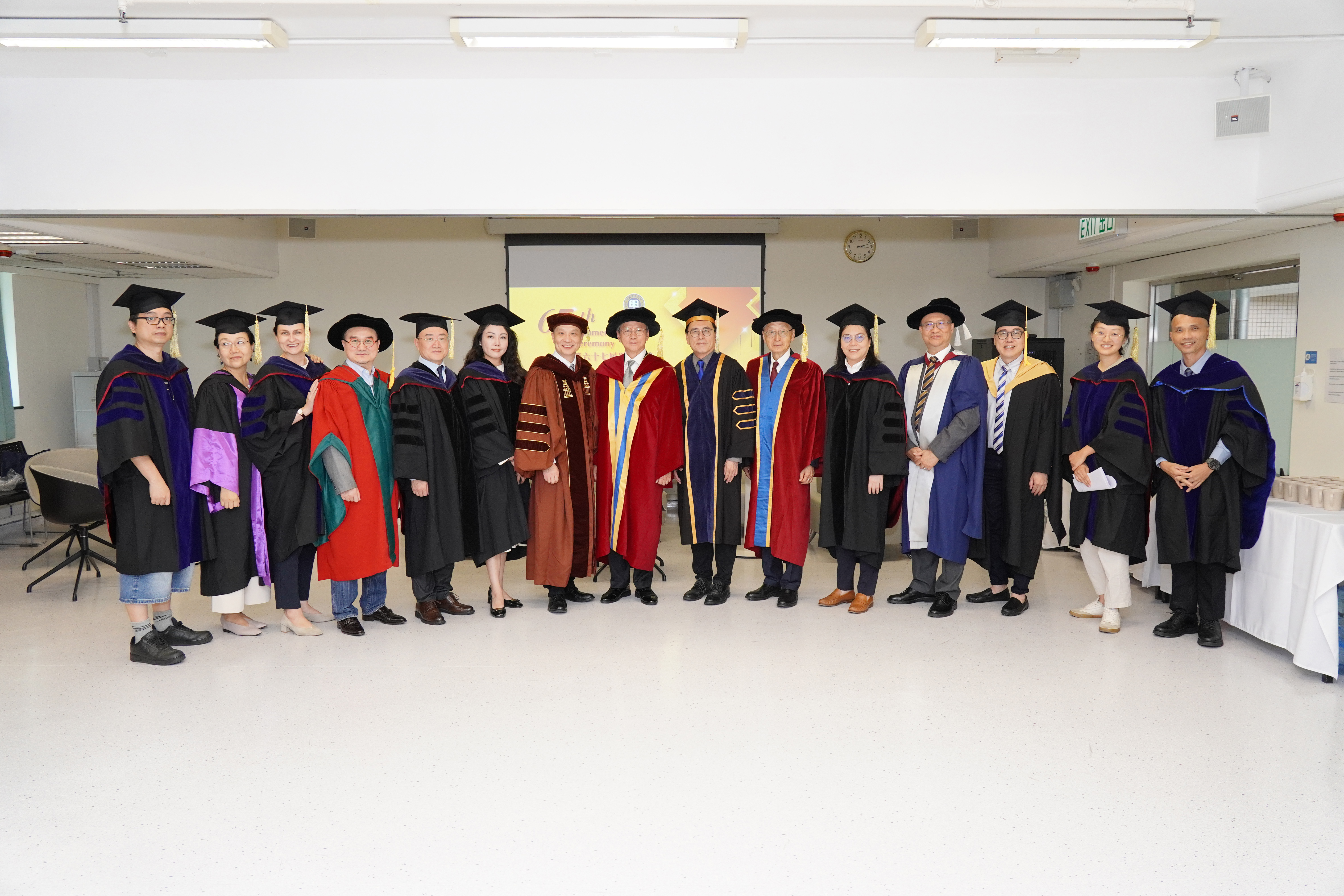 Group photo featuring (from left to right in the middle) Professor Zhang Han, Dean of the School of Business; Professor Justin Chiu Kwok hung, Honorary Doctor of HKBU of 2012; and Professor Martin Ding-fat Wong, Provost, and Professor Sunny Wong Hak-kun, Honorary University Fellow of HKBU of 2023, to celebrate the Class of 2026 at the 67th Commencement Ceremony.