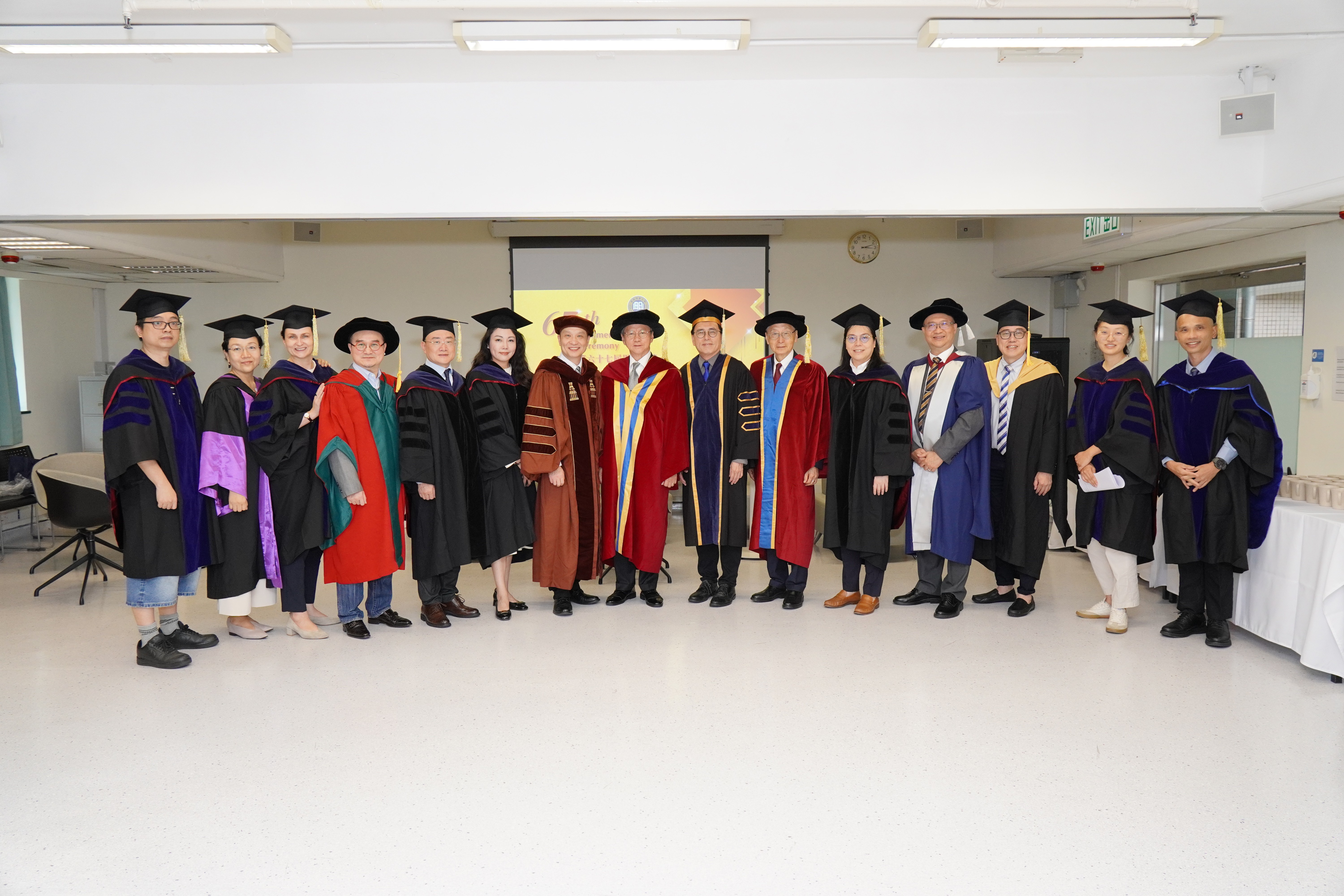 Group photo featuring (from left to right in the middle) Professor Zhang Han, Dean of the School of Business; Professor Justin Chiu Kwok hung, Honorary Doctor of HKBU of 2012; and Professor Martin Ding-fat Wong, Provost, and Professor Sunny Wong Hak-kun, Honorary University Fellow of HKBU of 2023, to celebrate the Class of 2026 at the 67th Commencement Ceremony.