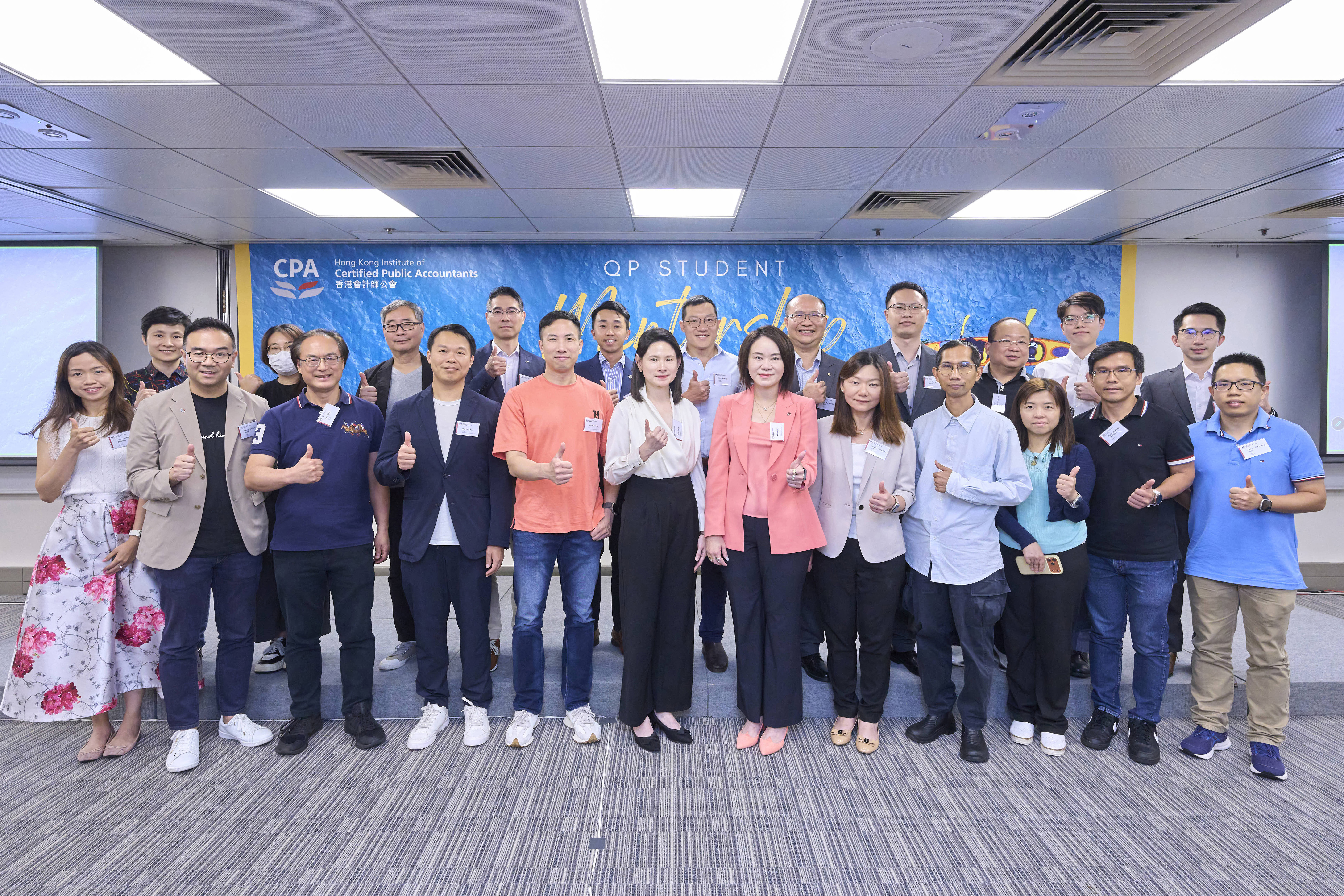 Dr Man Ko (fifth from the right, second row) joins the other mentors for a group photo.